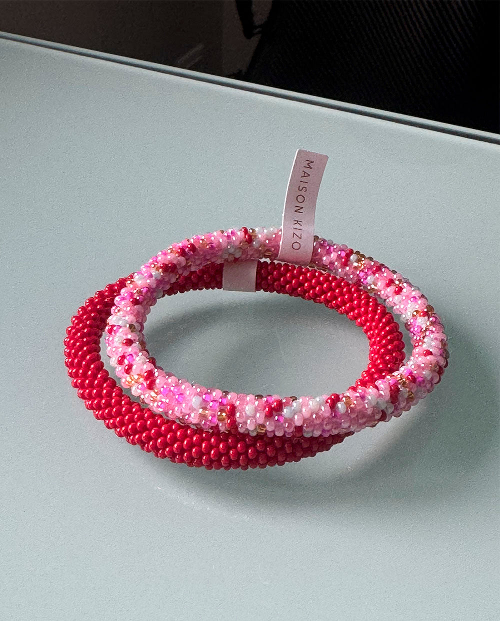 Combianción Pulseras nepal rosa y rojo