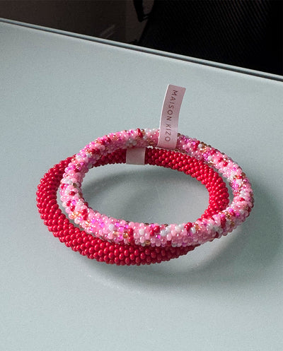Combianción Pulseras nepal rosa y rojo