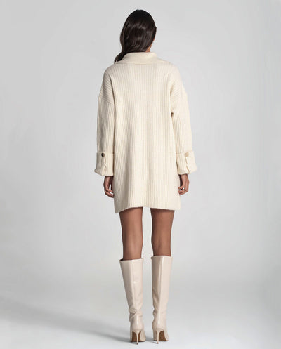 Vestido crudo con bordados en bolsillo Rüga