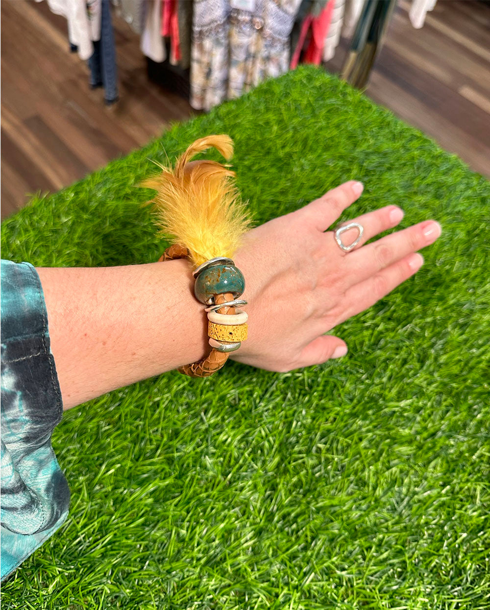 Brazalete pluma Dellmon